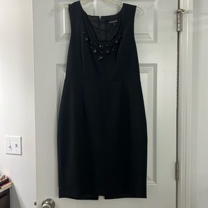 Black cocktail dress. Embellished v neck with back zipper